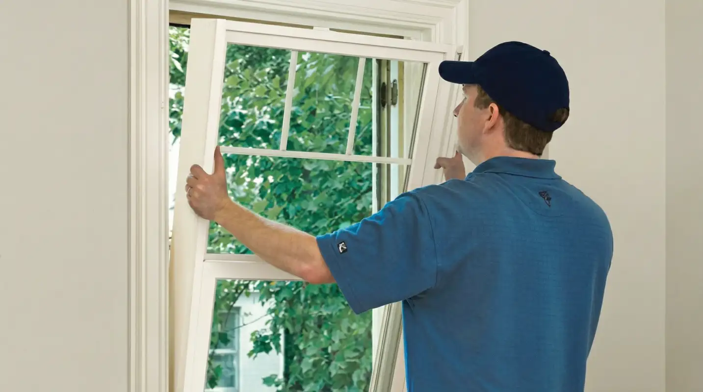 Professional contractors performing a residential window insulation and replacement service in Irvine, CA